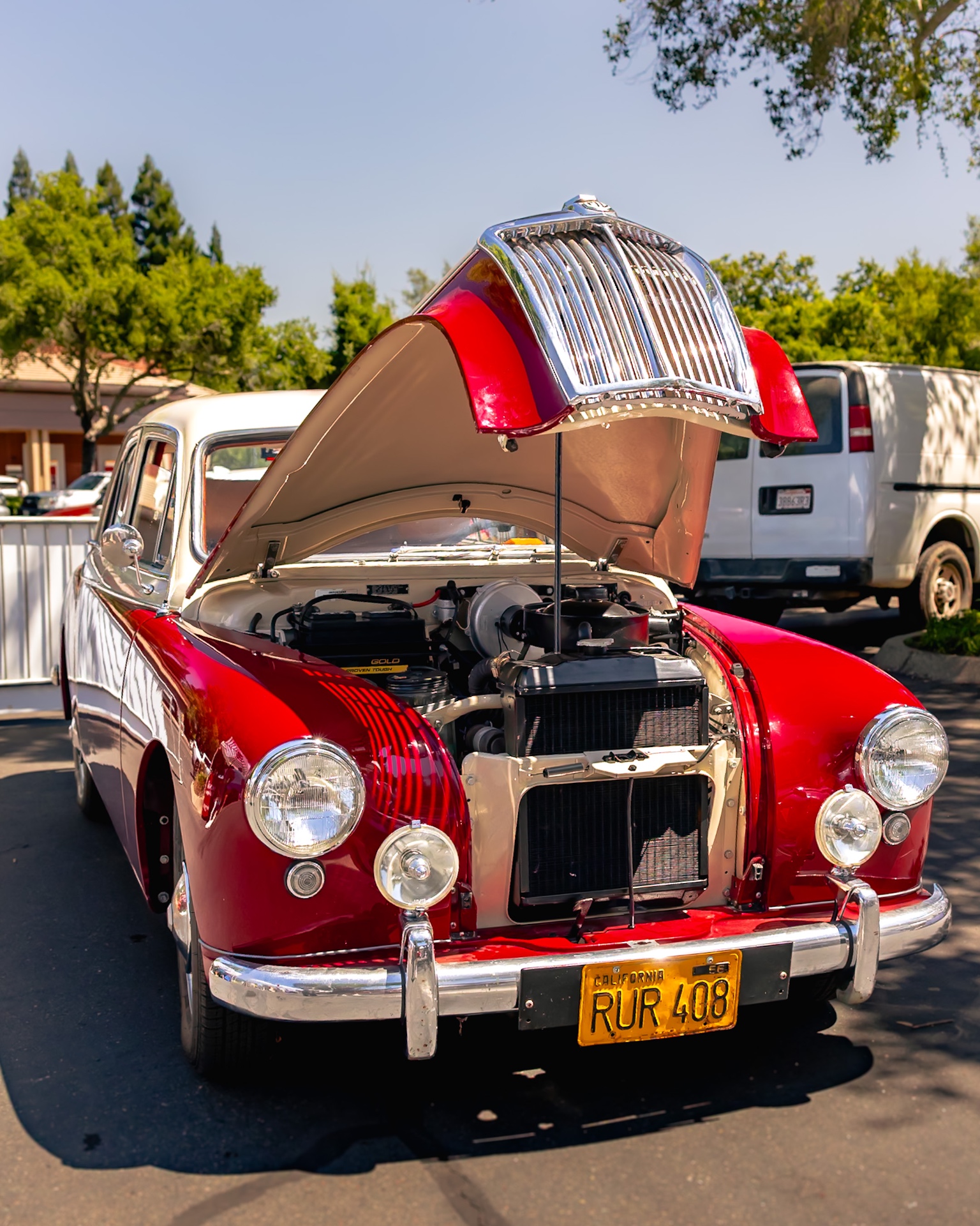 Red 1955 Wolseley with the hood up