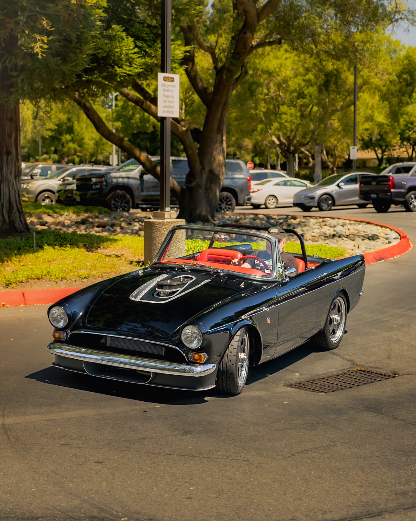 Black Sunbeam Tiger convertible rolling in