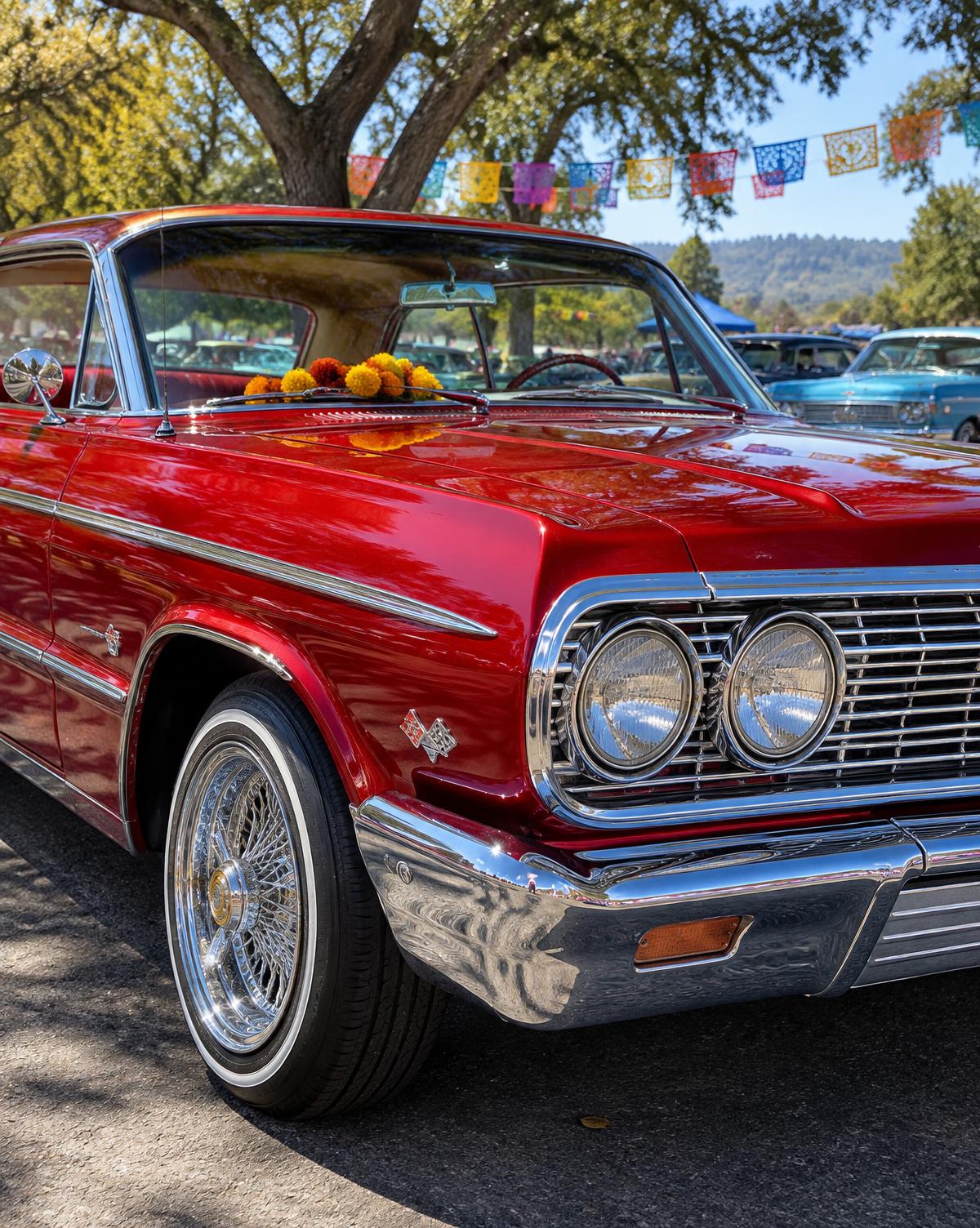 Red classic lowrider with chrome wire wheels and marigolds